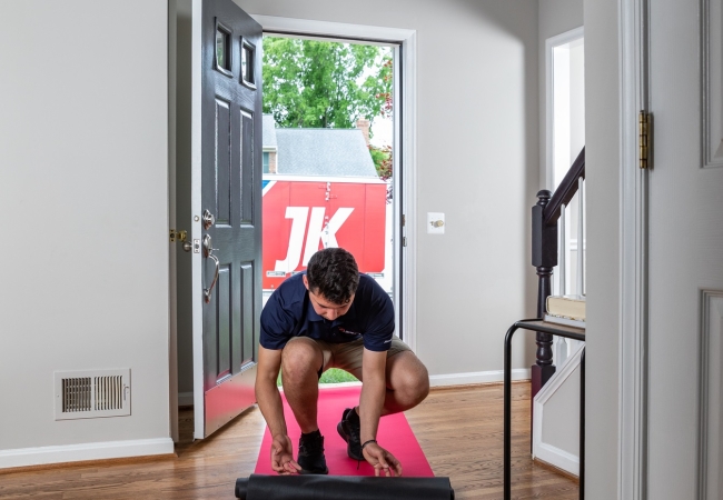 JK moving crew member protecting floor