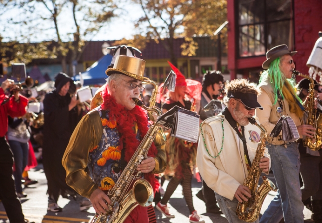 "Atlanta, United States - October 21, 2012: Celebrating the Little 5 Points Halloween Festival and Parade, a band dresses up festively and play their instruments as they march with the parade."