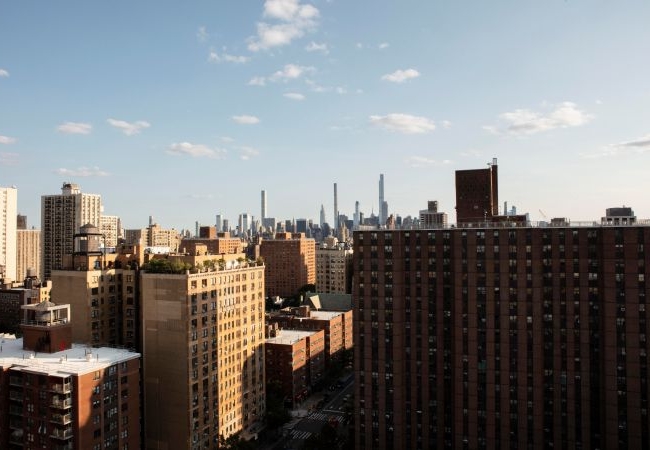 Skyline of New York City with busy streets below, representing job opportunities and the vibrant workforce in NYC.