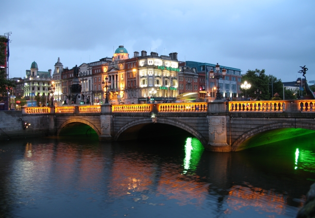 A scenic view of Dublin’s cityscape featuring the River Liffey, historic buildings, and modern architecture.