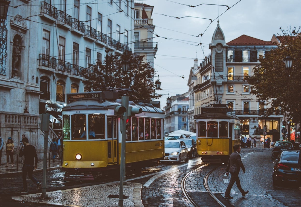 Scenic view of Portugal with a moving truck and boxes in the foreground, symbolizing a seamless relocation from the U.S. to Portugal.